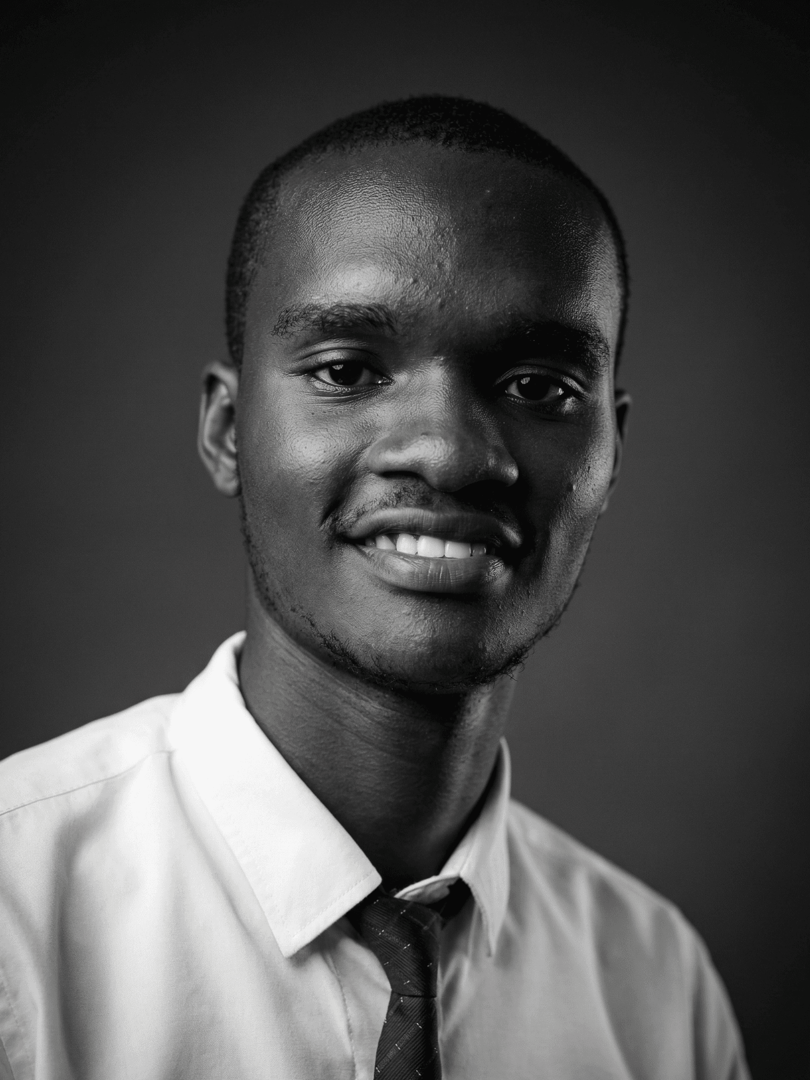 Victor Nwafor smiling in monotone.